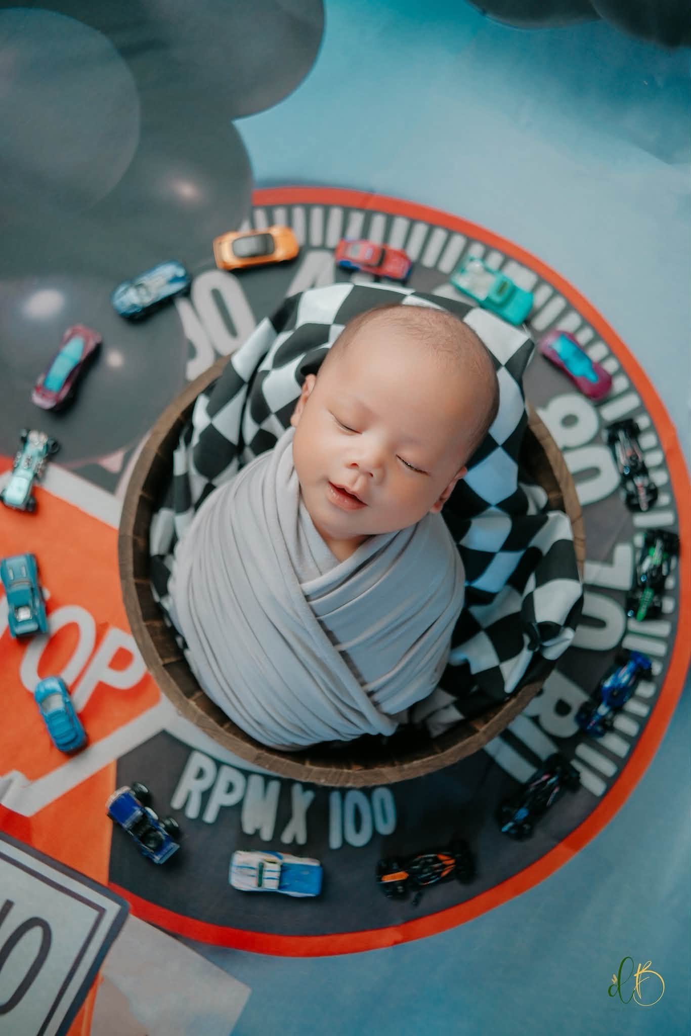 Newborn in a playful racing theme